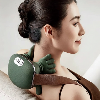 Woman using a green neck and shoulder massager on a neutral background